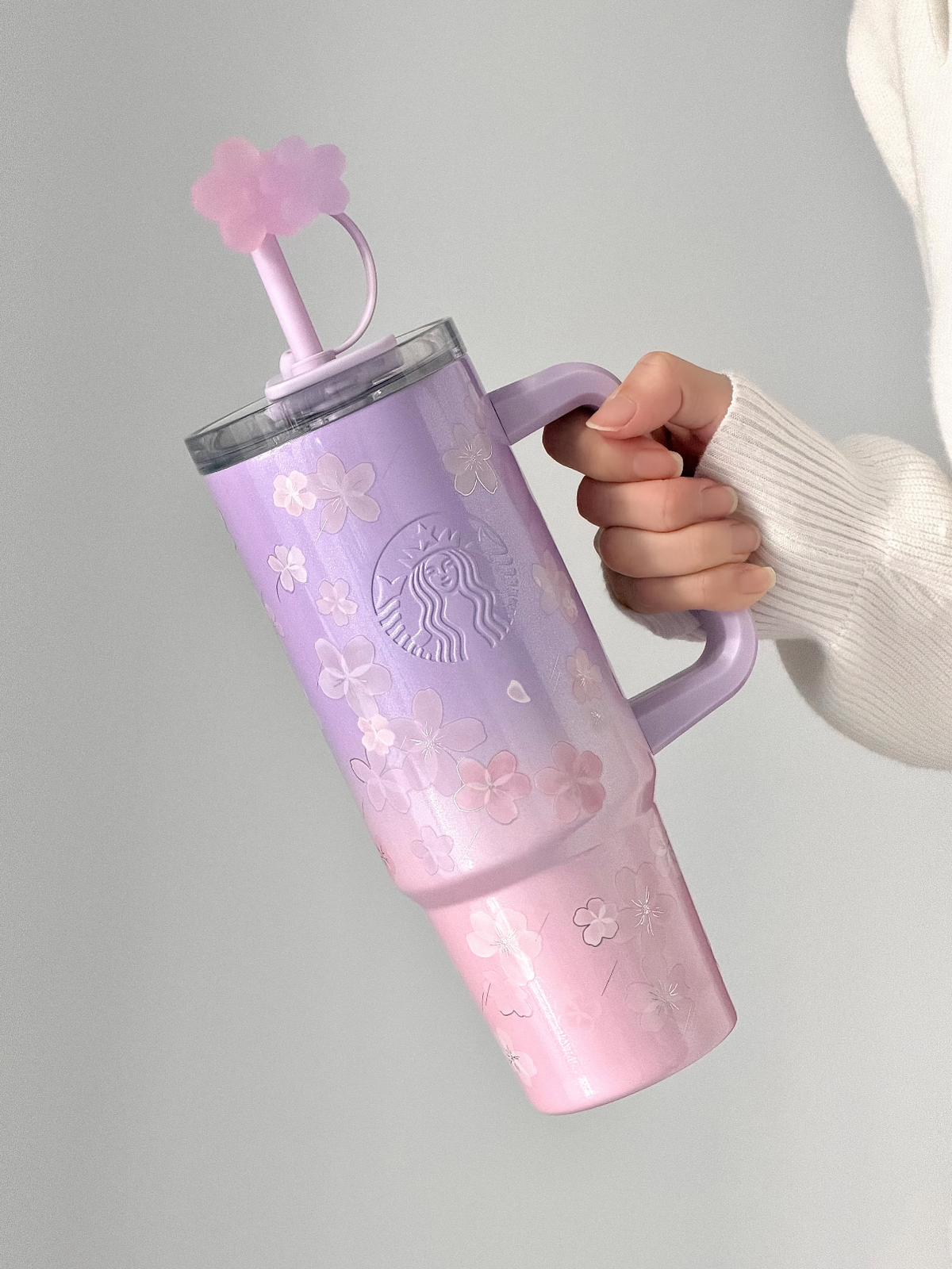 Starbucks Cherry Blossom Straw Tumbler 900ml with cup-shaped Charm on hand